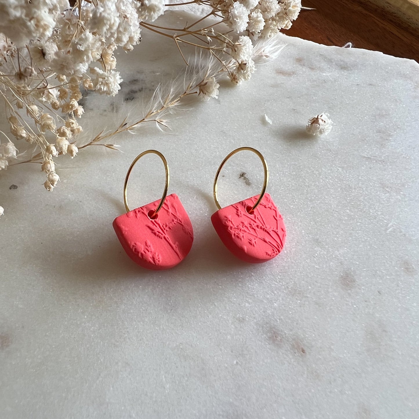 HIGAN HALF | half round drop on 15mm hoop earrings in blossom textured bright coral red
