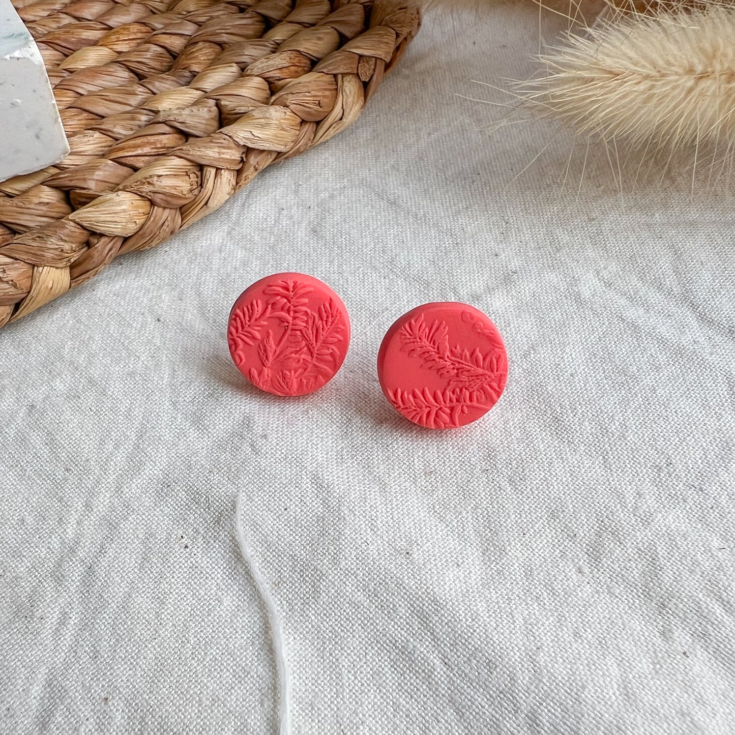 ROUND | Medium round leaf textured stud earrings in bright coral red