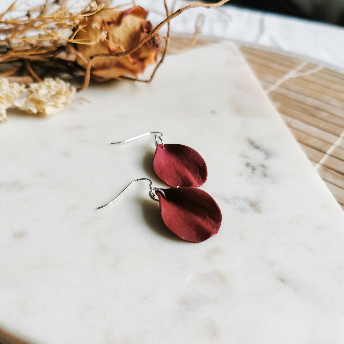 DELEN | small rose petal hook earrings in deep merlot red